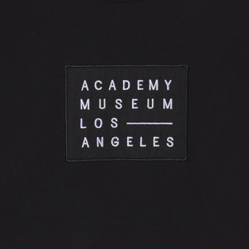 Black patch with 'Academy Museum Los Angeles' text on a black background
